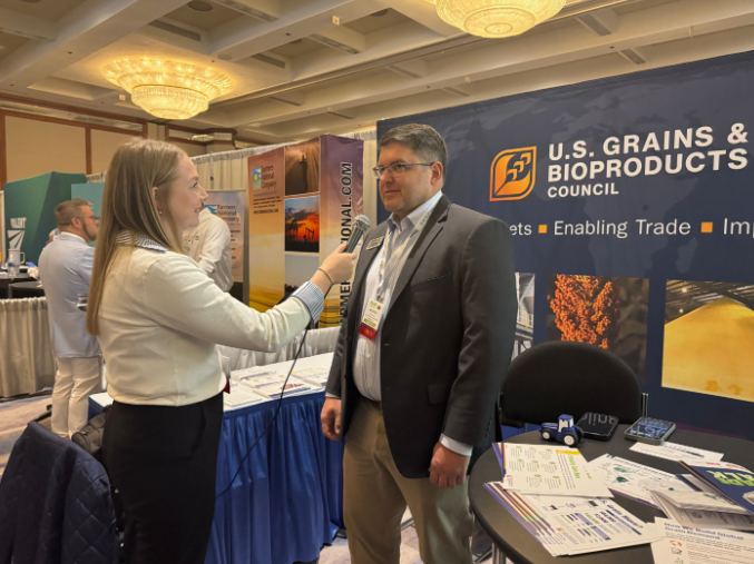 Andrew Brant speaking with Maci Carter at NAFB